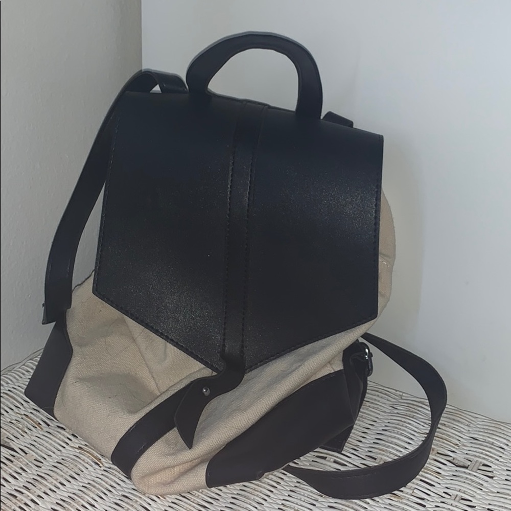 Beige and black mini back pack